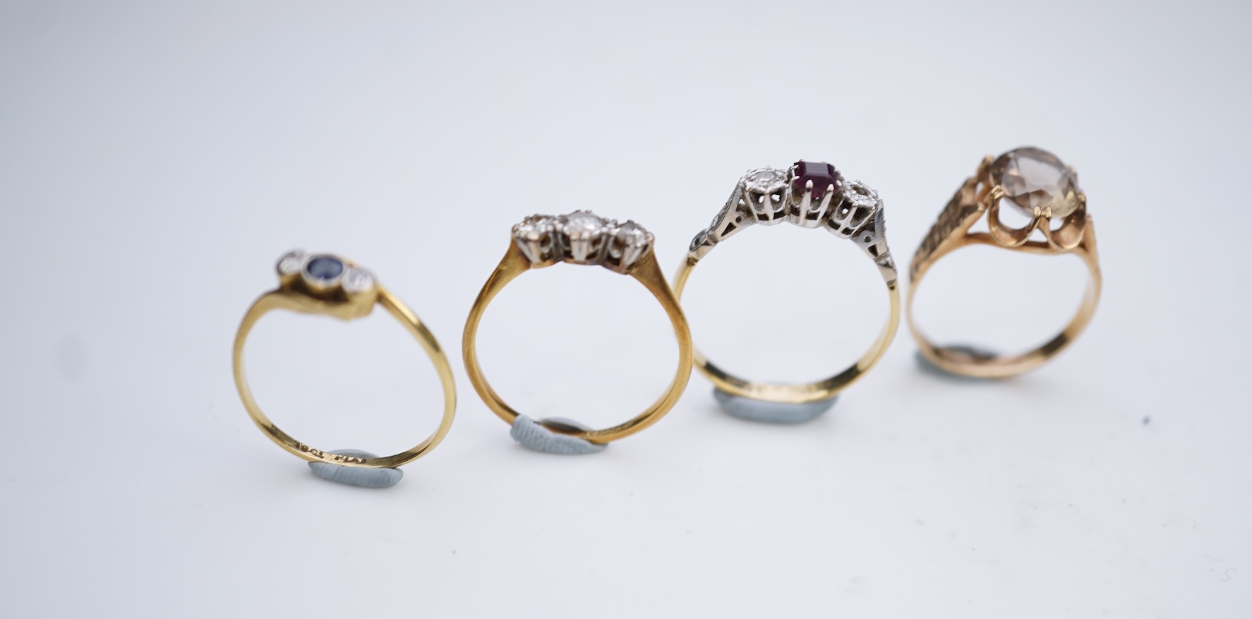 Four gem-set rings